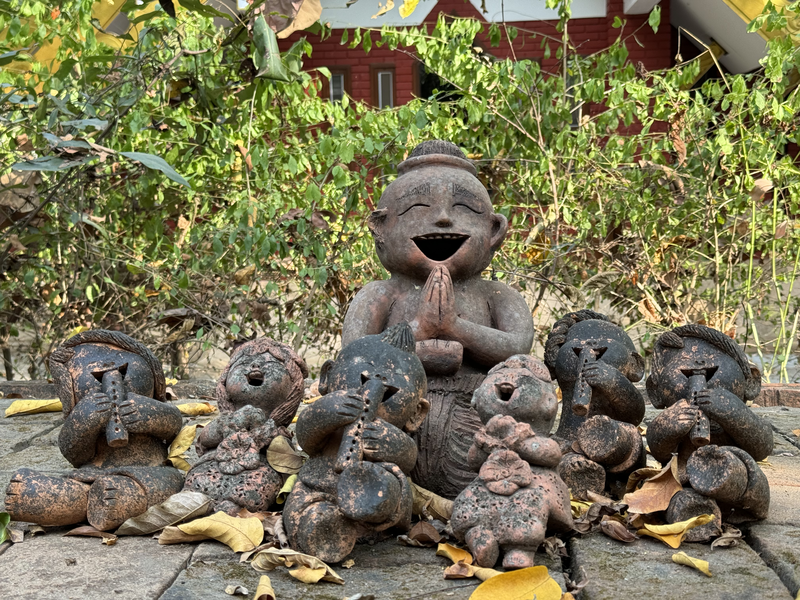 Old, weathered sculptures of singing figures