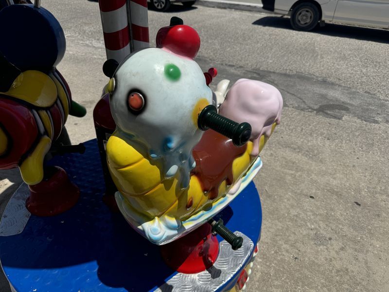 Bizarre ice cream sundae mount on a carousel