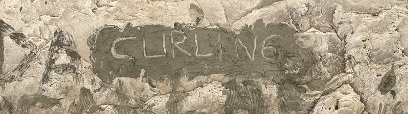 The word “curling” written in mud on a rock in a canyon outside Fethiye