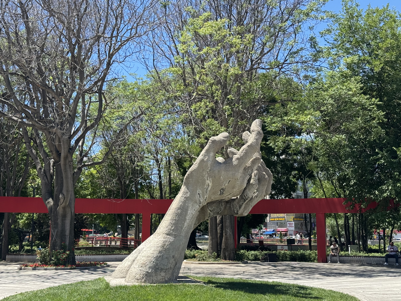 Park sculpture of a pair of hands reaching upwards in Ankara