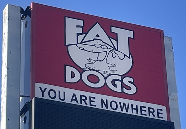Fat Dogs gas station sign proclaiming: YOU ARE NOWHERE